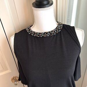 Jennifer Lopez black cold shoulder with embellished neckline